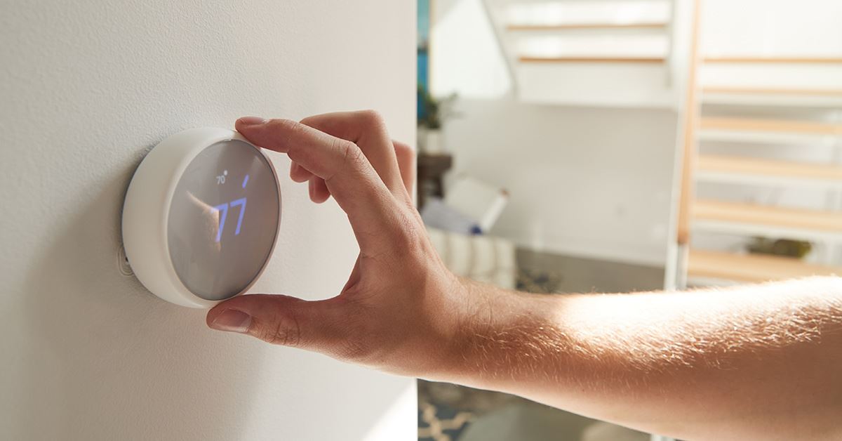 hand adjusting thermostat
